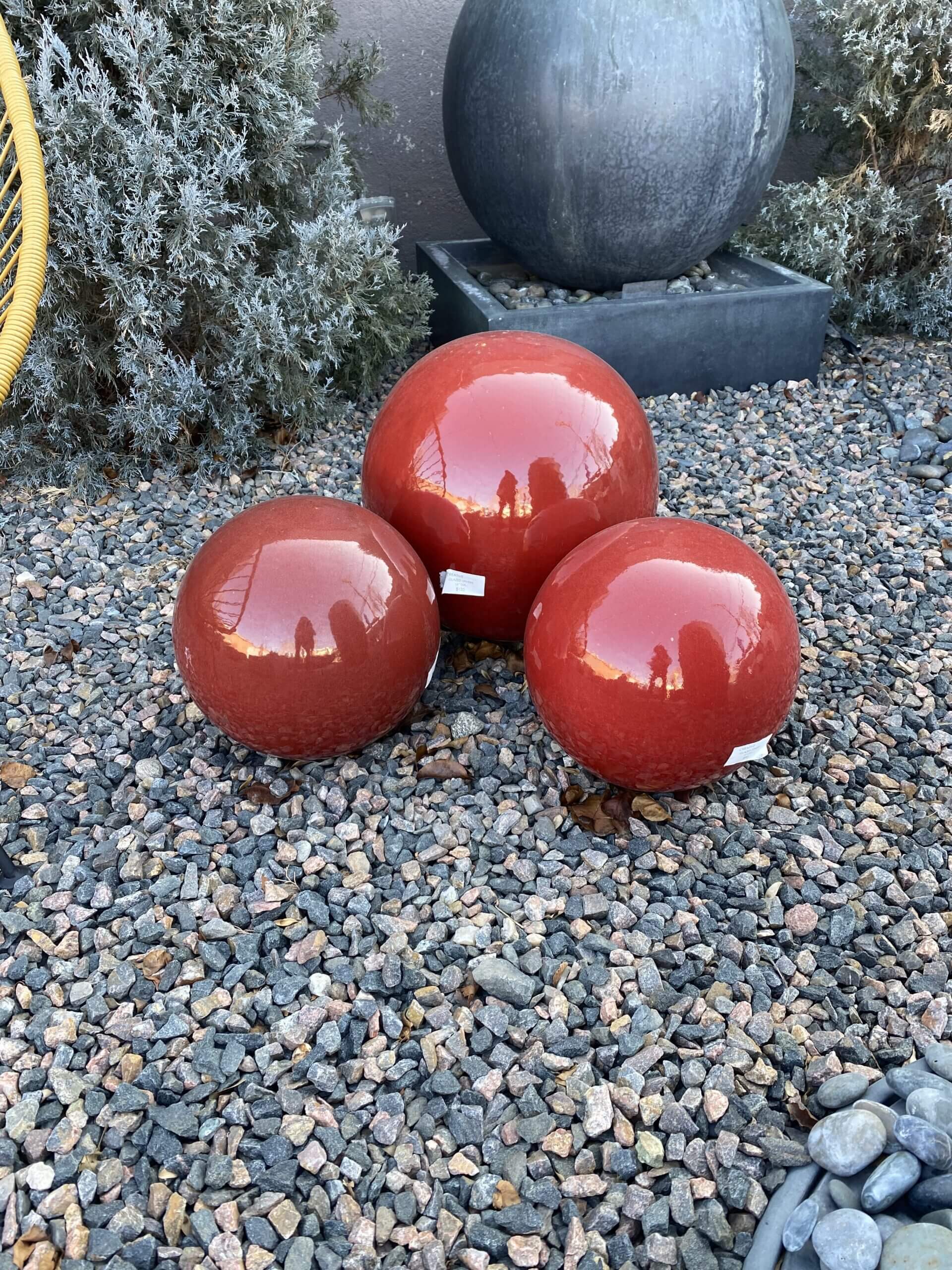 red decorative yard balls